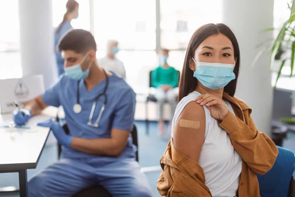 Doctor consulting patient about travel vaccines at AcuMed